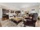 Comfortable living room boasts an open floor plan with a view into the kitchen and dining area at 4219 Moxie Way, Charlotte, NC 28215