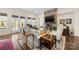 Spacious living room features a stone fireplace, hardwood floors, and access to backyard patio at 4219 Moxie Way, Charlotte, NC 28215