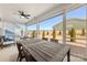 Large screened porch with dining furniture and backyard view at 4219 Moxie Way, Charlotte, NC 28215