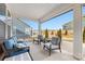 Relaxing screened porch with seating and outdoor table at 4219 Moxie Way, Charlotte, NC 28215