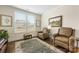 Bright sitting room with two leather armchairs and a patterned rug at 4219 Moxie Way, Charlotte, NC 28215