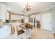 Eat-in kitchen with white cabinets, granite counters and island at 4469 Morning Dove Ct, Denver, NC 28037