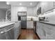 Modern kitchen with stainless steel appliances and white cabinets at 4554 Crestmont Dr, Charlotte, NC 28205