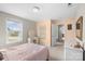 Bedroom with queen bed, dresser, and access to hallway at 5055 Stonehill Ln, Matthews, NC 28104