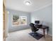 Bright home office featuring built-in shelving and large windows at 5055 Stonehill Ln, Matthews, NC 28104