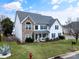 Two-story house with stone accents and a landscaped lawn at 5220 Sunriver Rd, Gastonia, NC 28054