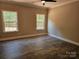 Bedroom featuring beautiful wood floors, large windows, and neutral wall colors at 609 Shiloh Unity Rd, Lancaster, SC 29720