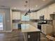 Modern kitchen with stainless steel appliances, white cabinets, and a spacious island perfect for entertaining at 609 Shiloh Unity Rd, Lancaster, SC 29720