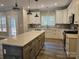 Modern kitchen with stainless steel appliances, white cabinets, and a spacious island perfect for meal preparation at 609 Shiloh Unity Rd, Lancaster, SC 29720