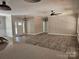 Bright, open living room with wood-look flooring and large windows, creating an inviting and airy atmosphere at 609 Shiloh Unity Rd, Lancaster, SC 29720