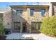 Backyard with brick, two-story home, well-maintained plants, barbecue, and outdoor lighting at 6411 Aldworth Ln, Charlotte, NC 28226
