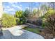 Backyard space with patio area, garden landscaping, and natural surroundings at 6411 Aldworth Ln, Charlotte, NC 28226