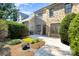 Backyard patio features a beautiful interlock patio and manicured landscaping at 6411 Aldworth Ln, Charlotte, NC 28226