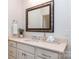 Charming bathroom with marble countertop, sink, decorative mirror, and towel-rack at 6411 Aldworth Ln, Charlotte, NC 28226