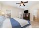 Bright bedroom featuring a large bed and built-in storage at 6411 Aldworth Ln, Charlotte, NC 28226