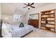 Charming bedroom featuring carpet, bedside table, large bookcase, bureau and natural light at 6411 Aldworth Ln, Charlotte, NC 28226