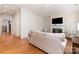 Spacious living area with hardwood floors, fireplace and natural light at 6411 Aldworth Ln, Charlotte, NC 28226