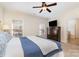 Bright main bedroom with TV, carpet, window and ceiling fan that provides a relaxing retreat at 6411 Aldworth Ln, Charlotte, NC 28226