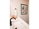 Bathroom with updated sink, fixtures, and colorful art at 8052 Cedarsmith Ct, Charlotte, NC 28217