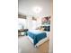 Spacious bedroom with teal bedding, large windows, and stylish wall art at 8052 Cedarsmith Ct, Charlotte, NC 28217