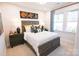 Charming bedroom featuring a wooden bed frame and stylish decor at 8052 Cedarsmith Ct, Charlotte, NC 28217