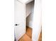 Small closet under the stairs with a single rod for hanging clothes at 8052 Cedarsmith Ct, Charlotte, NC 28217