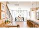 Bright dining room features a modern chandelier and hardwood floors at 8052 Cedarsmith Ct, Charlotte, NC 28217