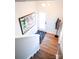 Clean and bright entryway with hardwood floors and modern light fixture at 8052 Cedarsmith Ct, Charlotte, NC 28217