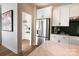 Stainless steel refrigerator, white shaker cabinets, and walk-in pantry at 8052 Cedarsmith Ct, Charlotte, NC 28217