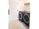 Convenient laundry room with front load washer and dryer at 8052 Cedarsmith Ct, Charlotte, NC 28217