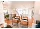 Open concept living room with hardwood floors and leather armchairs at 8052 Cedarsmith Ct, Charlotte, NC 28217