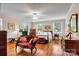 Well-lit bedroom with hardwood floors and a comfortable sitting area at 842 North Center St, Hickory, NC 28601