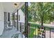 Relaxing covered porch overlooks a tree-lined street and grassy yard at 842 North Center St, Hickory, NC 28601