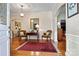 Elegant entryway with hardwood floors, ornate mirror and comfortable seating at 842 North Center St, Hickory, NC 28601