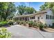 White brick home with a long driveway and lush landscaping at 842 North Center St, Hickory, NC 28601
