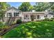 White brick home with stone accents and a spacious front yard at 842 North Center St, Hickory, NC 28601