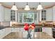 Updated kitchen featuring white cabinets, granite countertops and a center island at 842 North Center St, Hickory, NC 28601
