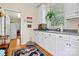 Well-equipped laundry room with white cabinets and a utility sink at 842 North Center St, Hickory, NC 28601