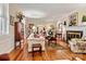 Bright living room with hardwood floors, fireplace and views into adjacent rooms at 842 North Center St, Hickory, NC 28601
