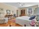 Bright main bedroom with hardwood floors, built-ins and sitting area at 842 North Center St, Hickory, NC 28601