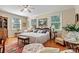 Spacious main bedroom with hardwood floors, ceiling fan, and lots of light at 842 North Center St, Hickory, NC 28601