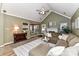 Living room with vaulted ceilings, L-shaped sofa, and access to kitchen at 9100 Pine Springs Ct, Huntersville, NC 28078