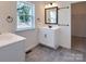 Bright bathroom with white vanity, tile floor, and walk-in closet at Lot 2 Glenview Meadow Dr # Savanh, Waxhaw, NC 28173