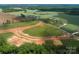 An aerial view of new construction surrounded by green landscape, illustrating a developing community at Lot 2 Glenview Meadow Dr # Savanh, Waxhaw, NC 28173