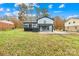 Spacious backyard with shed and a partially covered patio at 1001 Archdale Dr, Charlotte, NC 28217