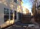 Backyard with a wooden deck and small patio area at 10244 Blakeney Preserve Dr, Charlotte, NC 28277