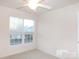 Bedroom with window, ceiling fan and neutral walls at 10244 Blakeney Preserve Dr, Charlotte, NC 28277