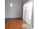 Bright dining area with hardwood floors and sliding glass doors at 10244 Blakeney Preserve Dr, Charlotte, NC 28277