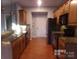 Kitchen with granite countertops and wooden cabinets at 10244 Blakeney Preserve Dr, Charlotte, NC 28277