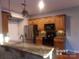 Modern kitchen with granite countertops and stainless steel appliances at 10244 Blakeney Preserve Dr, Charlotte, NC 28277